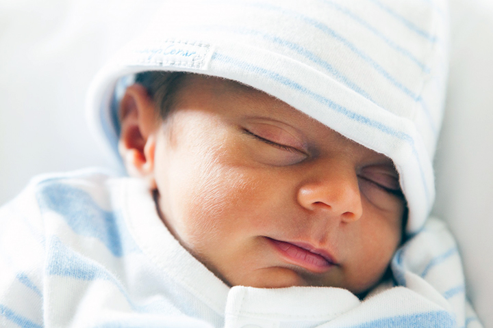 Genome tests at birth could reduce screening costs of newborns. Photo by Vera Kratochvil. Newborn infant.